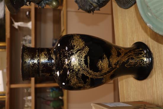 An 18th century Chinese gilt decorated mirror black glazed baluster vase, drilled hole